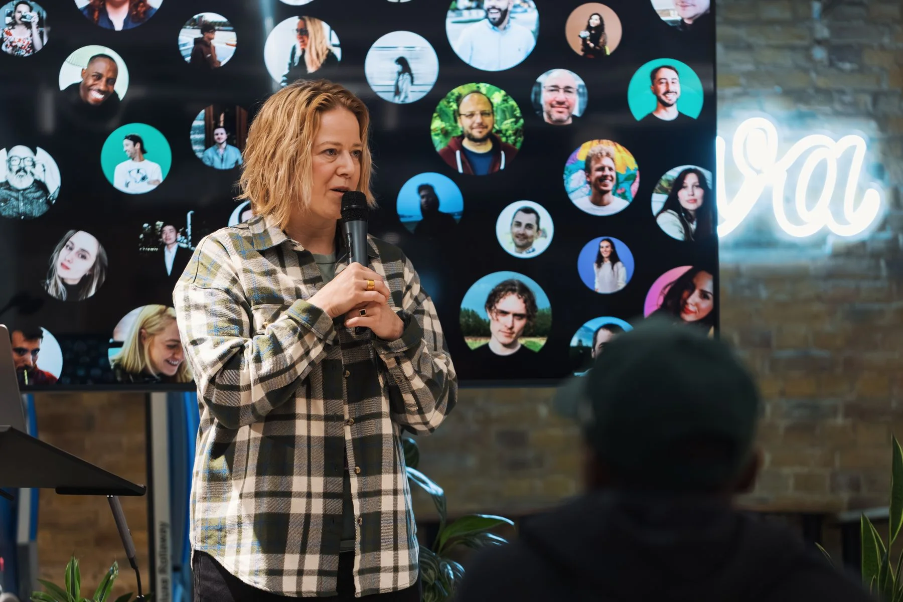 Speaker presenting to an audience at a professional event