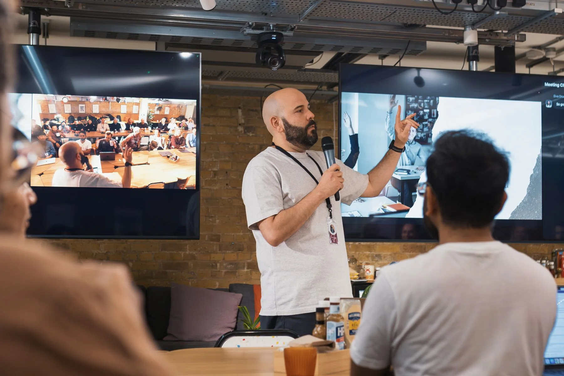 Presenter engaging an audience at a modern business event