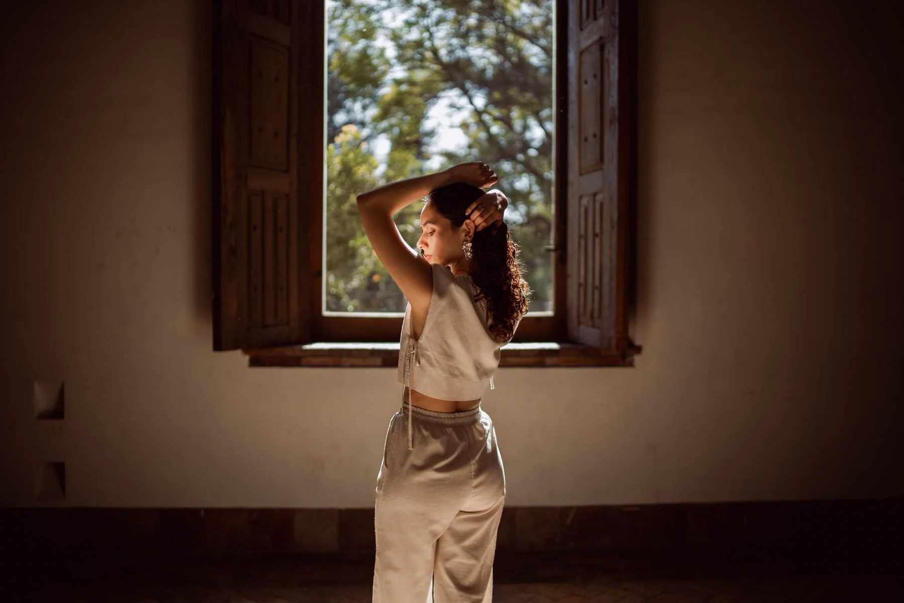 Woman photographed in warm natural window light
