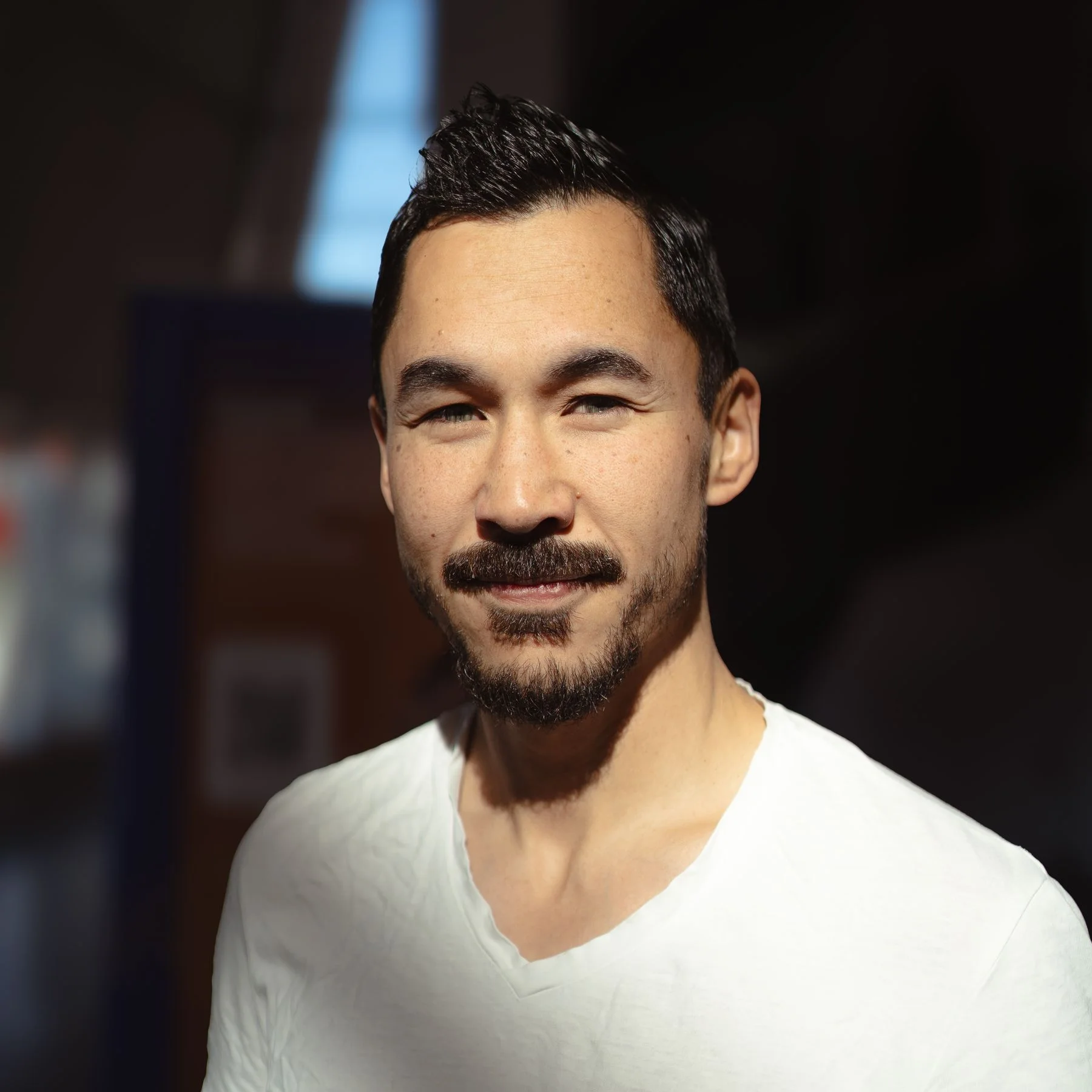 Man photographed indoors using soft natural light